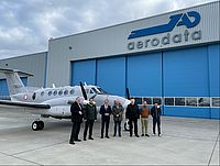 A delegation of The Armed Forces of Malta in front of their King Air B200 during a visit at Aerodata.